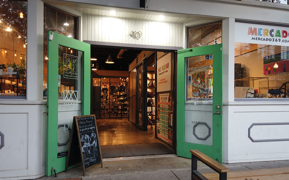 Bright green french glass doors at Mosaic Maker's Collective in Bishop Arts District.