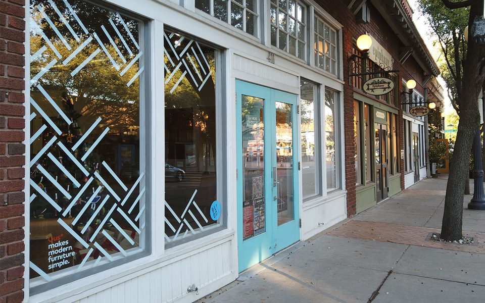 White and blue storefront at Neighborhood, a store located in Bishop Arts District.