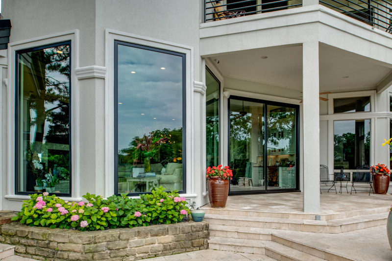 backyard view of pictures windows and sliding patio door