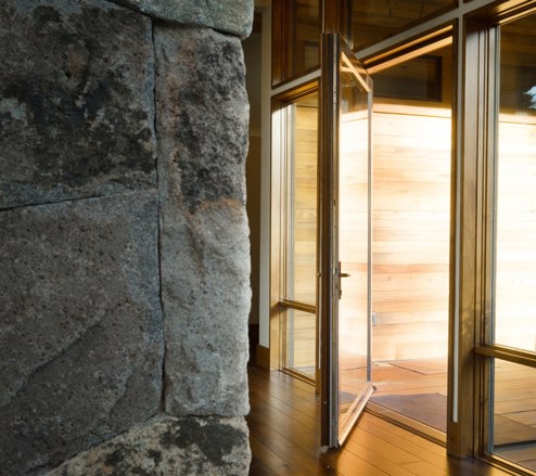gold plated door with a marble walls