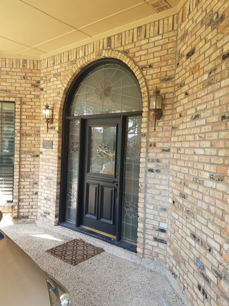 black door with specialty picture windows