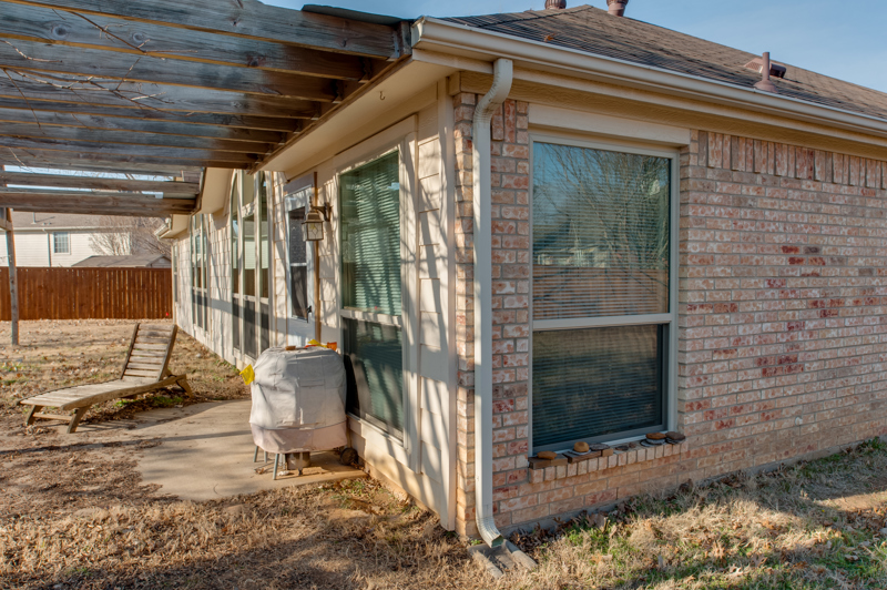 brennan-traditions-backyard-side-of-house