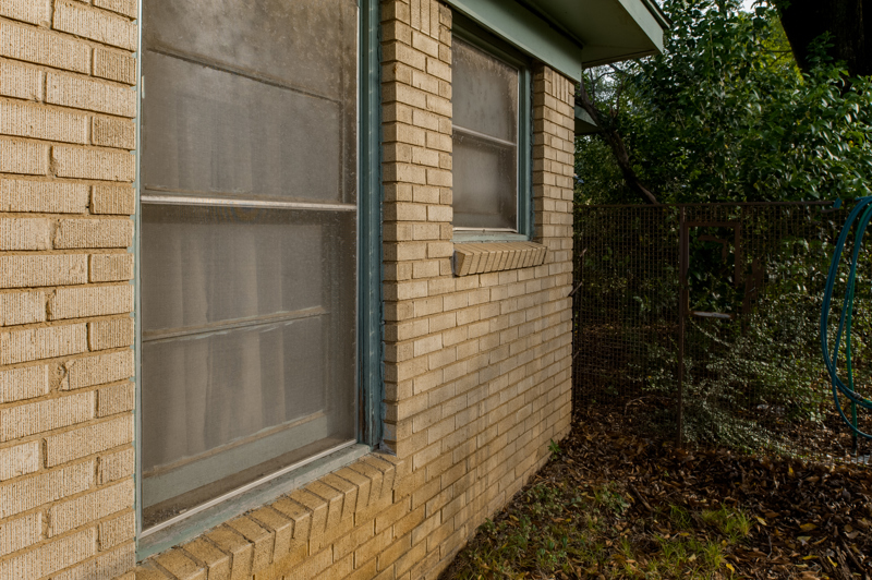 brennan-traditions-windows-brick-house-teal