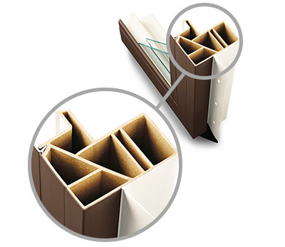 Image of Andersen 100 Series corner cut. The corner cut shows the profile of a composite window. In this case, the composite is called Fibrex and is made from wood and polymer fibers.