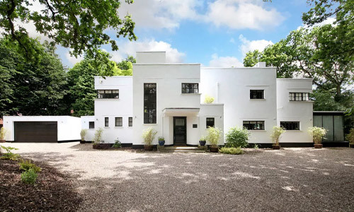 Example of an International Style house featuring narrow frame windows.