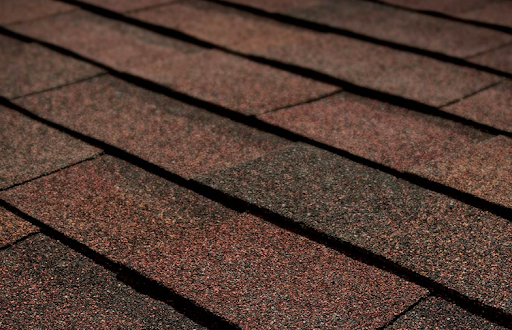 Patch of Tamko Heritage Woodgate asphalt shingles in rustic red.