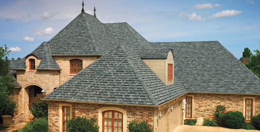 Camelot roofing shingles on a mixed facade home.