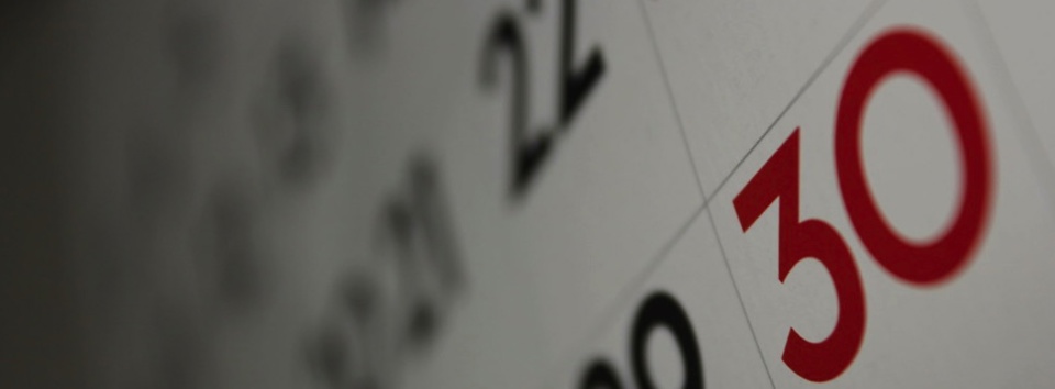 A black, white, and red wall calendar.